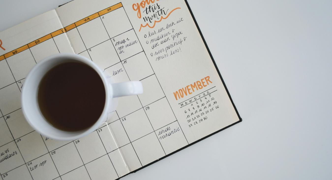 coffee on scheduler notepad